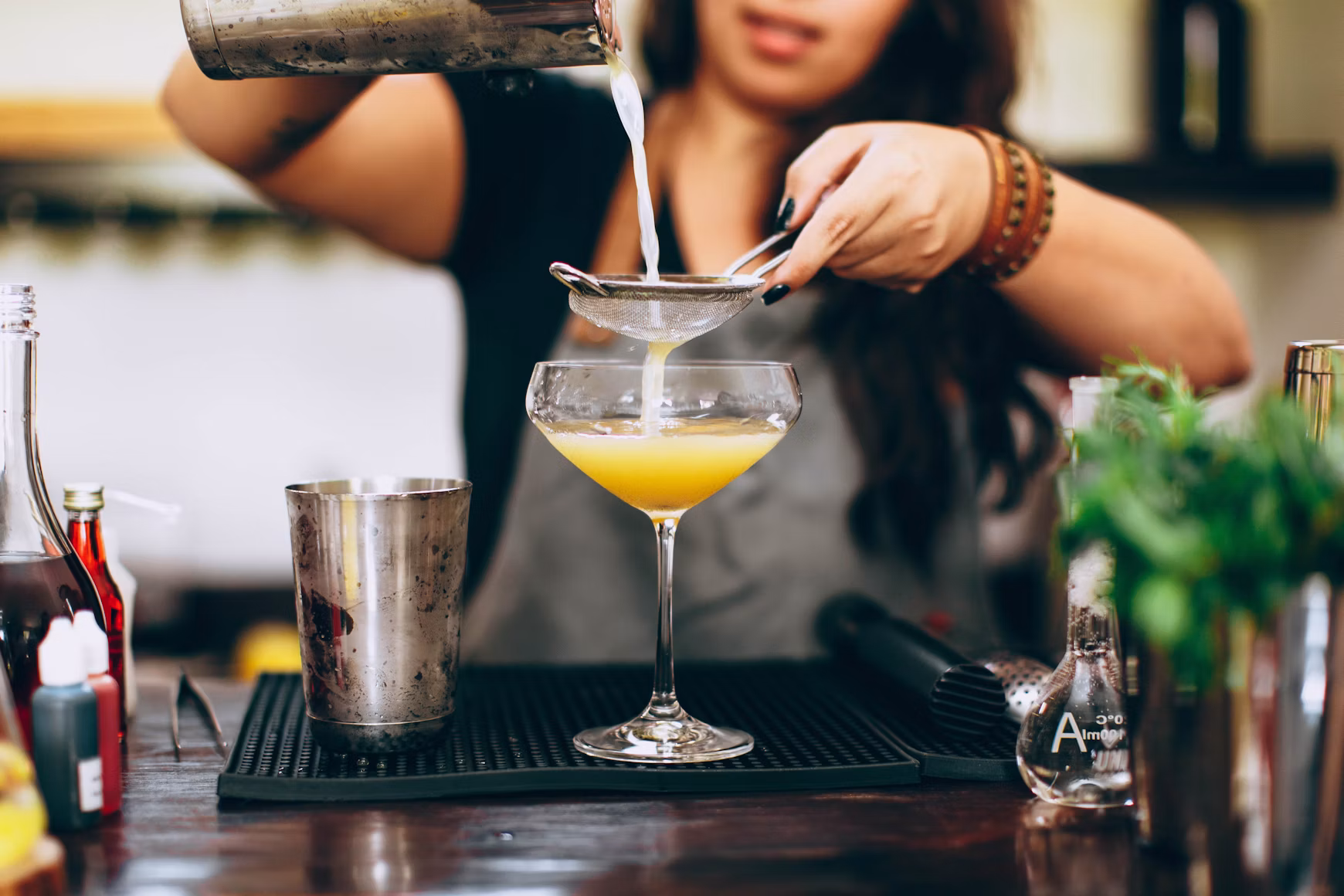 Bartender pouring a cocktail